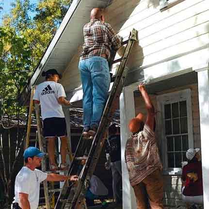 Volunteering Painting a House
